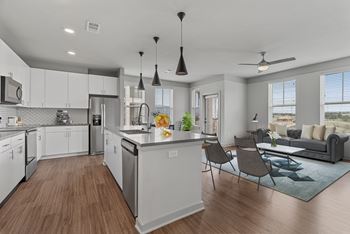 Stainless steel appliances, designer cabinetry, stone counters & tile backsplash